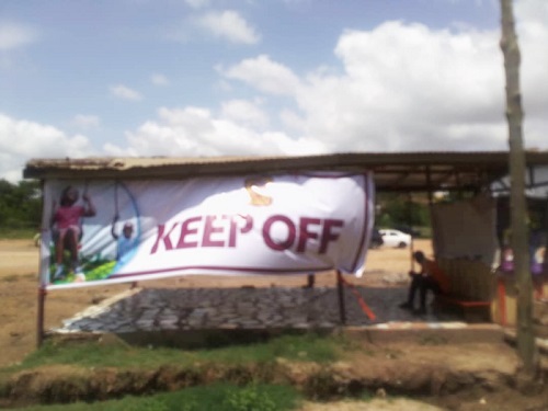 Keep off banner at the park to ward off the private developer