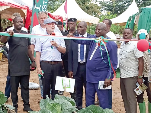 Jeroen Verheul (2nd from left), Netherlands Ambassador to Ghana, being assisted by Ansu Kumi (left), Sunyani Municipal Chief Executive, and Denis Abugri Amenga (2nd from right), Bono Regional Director of Agriculture, to inaugurate the learning farm Jeroen Verheul (2nd from left), Netherlands Ambassador to Ghana, being assisted by Ansu Kumi (left), Sunyani Municipal Chief Executive, and Denis Abugri Amenga (2nd from right), Bono Regional Director of Agriculture, to inaugurate the learning farm