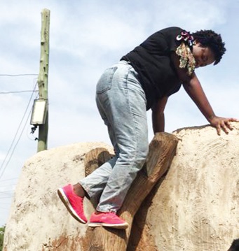 To prevent a “Humpty Dumpty” fall, Ms Akese descends the log ladder a step at a time
