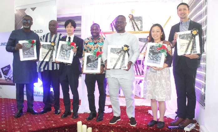  Francis Asenso-Boakye (3rd from right), Minister of Roads and Highways; Suzuki Momoko (2nd from right), Chief Representative, JICA Ghana; Kwabena Bempong (left), President of the Ghana Institution of Engineering; Dr Abass M. Awolu (2nd from left), Chief Director of the Ministry of Roads and Highways, launching the roads and bridges manuals in Accra. With them are some participants in the event. Picture: ESTHER ADJORKOR ADJEI