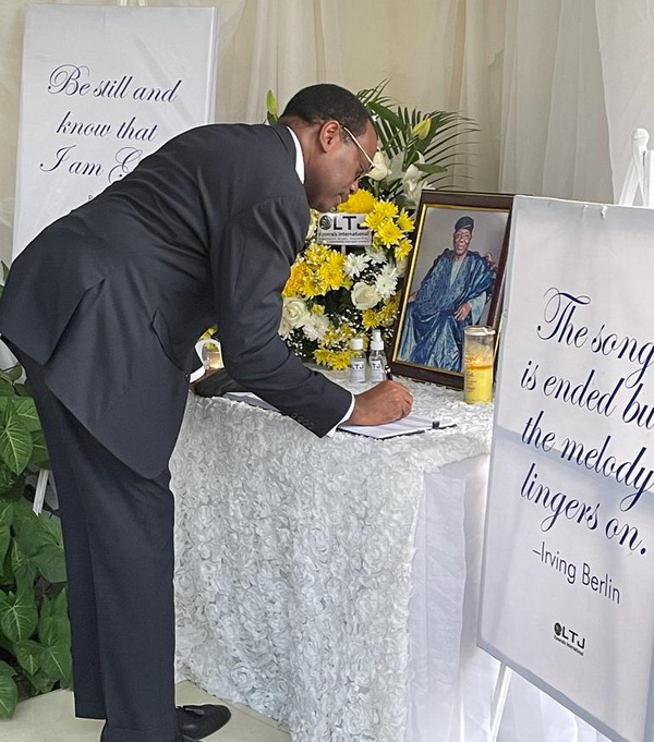 Dr Akinwumi Adesina, President of the African Development Bank Group writes in the Book of Condolence in honour of the late Chief Ernest Shonekan.
