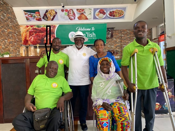 Azumah Nelson (in hat) with Mr Mends (arrowed) and other members of the More Hope for the Disabled Foundation