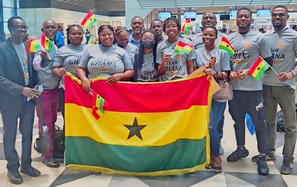 Players and officials of the Chess team displaying the Ghana flag at the Kotoka International Airport prior to their departure for the  tournament