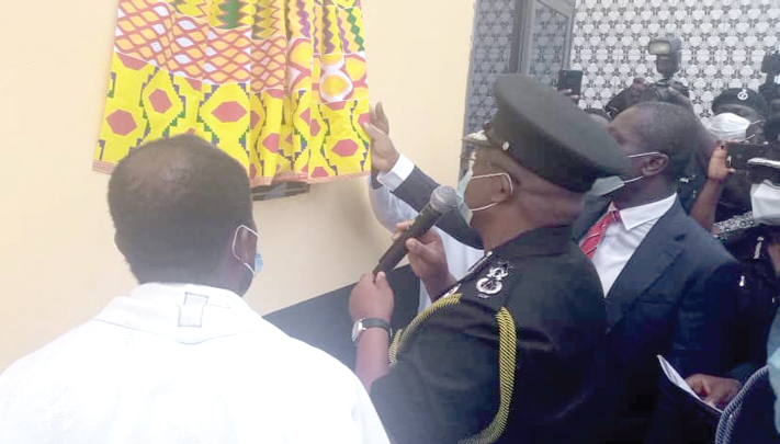 Mr Oppong-Boanuh and Mr Afenyo-Markin jointly unveiling a plaque to inaugurate the new police station. 