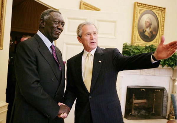 • President George W. Bush welcomes Ghana President John Agyekum Kufuor to the Oval Office at the White House, Wednesday, April 12, 2006