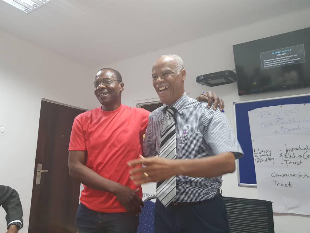The resolution agreement was signed by Mr Affail Monney on behalf of the defendants and Mr Lloyd Evans on behalf of the plaintiffs. This picture was taken after the signing