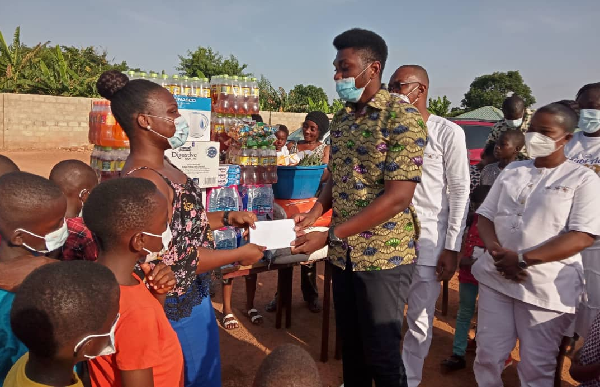 The son of Rev. Adjei also presenting some cash amount to celebrate his birthday