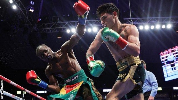 Flashback; Garcia (left) launches a right hook at Tagoe in their bout on April 9