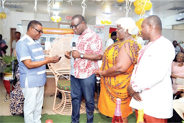 • Theophilus Yartey (2nd from left), acting Editor of the Daily Graphic, presenting a receipt for a fridge presented to Kobby Asmah by the Graphic Editorial Board. With them are Samuel Bio, Night Editor, and Mary Mensah, Foreign Editor of the Daily Graphic  