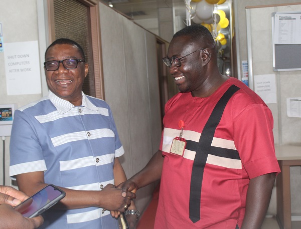 Kobby with the editor of Graphic Online, Enoch Frimpong