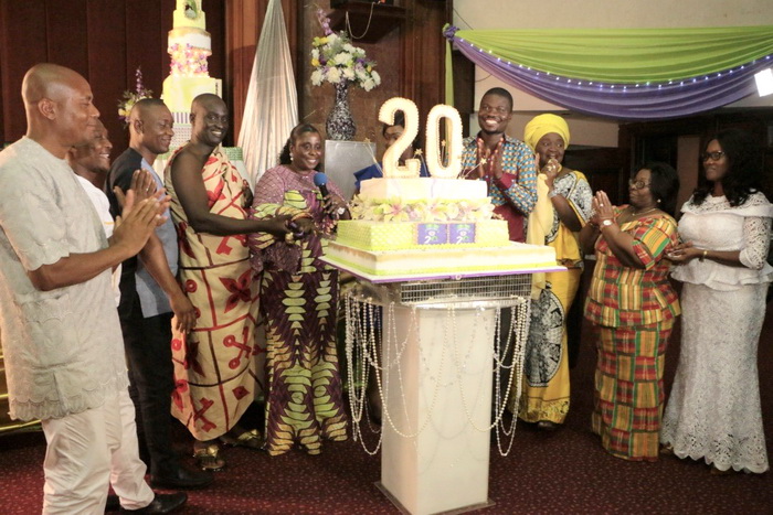 Nana Ansah Prem, in cloth, supporting other dignitaries, including EKGS Director, Mrs Efua Goode-Obeng Kyei to cut the anniversary cake.