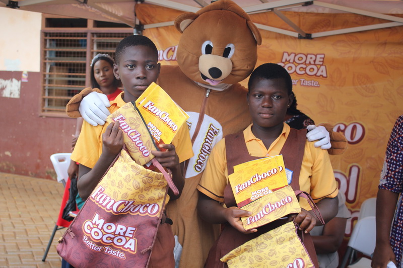 Isaac Kwaku, Primary 5 pupil of the La Wireless 6&7 primary school and Rebecca Ajutuak, a JHS 2 student of the La Wireless 1 Junior Secondary School who were awarded for being among the best collectors of FanChoco wrappers displaying their prizes.