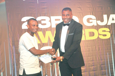  Mr Franklin Sowa, Director, Marketing of GCGL, presenting the Best Local Radio Award to a representative of Obonu FM