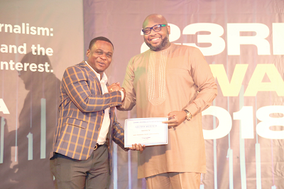 Mr Randy Abbey, host of Good Morning Ghana Show on Metro TV, receiving the award for Best Morning Show from Mr Robert Coleman of Zoomlion (left)