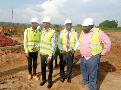 •  Samples of the bricks to be produced by the company used in the construction of an office for the company. Inset: Mr Evans Opoku-Bobbie (2nd left) inspecting work on the project at Tanoso, near Sunyani