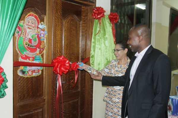 Mrs Jodene Smith,  General Manager, Transitions, and Dr Anthony Quampah, Medical Director, GAEC Hospital, cutting the tape to inaugurate the refurbished Children's Ward. 