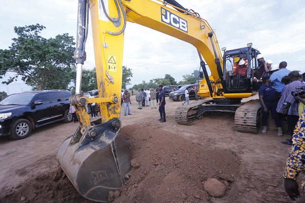 President Akufo-Addo cutting a sod for the construction of a road network in the area