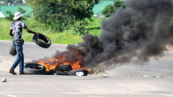 Protesters in Harare and Bulawayo blocked roads and lit fires to express their anger over the new fuel prices Protesters in Harare and Bulawayo blocked roads and lit fires to express their anger over the new fuel prices