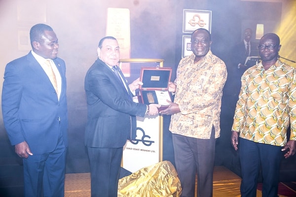 Dr Said Deraz (2nd left) presenting the first certified gold bar to Mr Alan Kyerematen. With them are Mr Asoma Cheremeh (right), the Minister of Lands and Natural Resources, and Mr Samuel Nortey, MD of Gold Coast Refinery