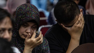 Distraught relatives demanded answers at an emotional meeting with Indonesian authorities Distraught relatives demanded answers at an emotional meeting with Indonesian authorities
