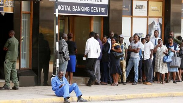 Long queues have been a common sight outside banks in Zimbabwe Long queues have been a common sight outside banks in Zimbabwe