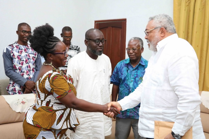 President Rawlings interacting with Madam Emy Frimpong