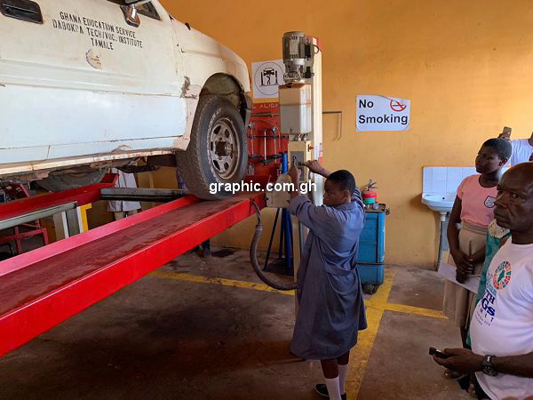 A female student demonstrating her skills on Automotive engineering A female student demonstrating her skills on Automotive engineering