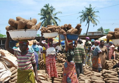 Yam glut: basins of yam being carried for sale Yam glut: basins of yam being carried for sale