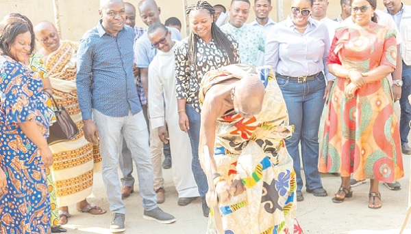 • Osabarimba Kwesi Atta II (inset), Paramount Chief of Cape Coast and an old student of Philip Quaque Boys School, cutting the sod for work to begin on the project