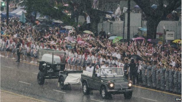 Crowds lined the entire funeral route through the city despite pouring rain