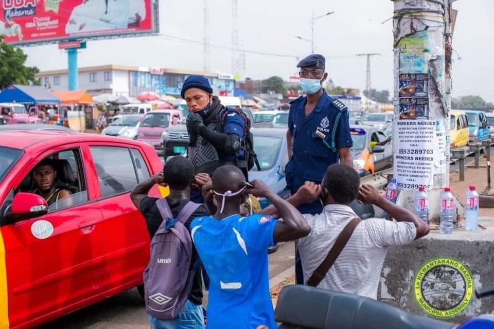 Three men do the squats as punishment for failing to use the footbridge provided at Madina Three men do the squats as punishment for failing to use the footbridge provided at Madina