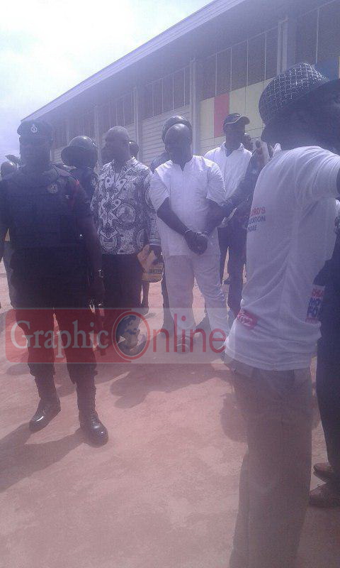 Maxwell Kofi Jumah in handcuffs on his way to police cells