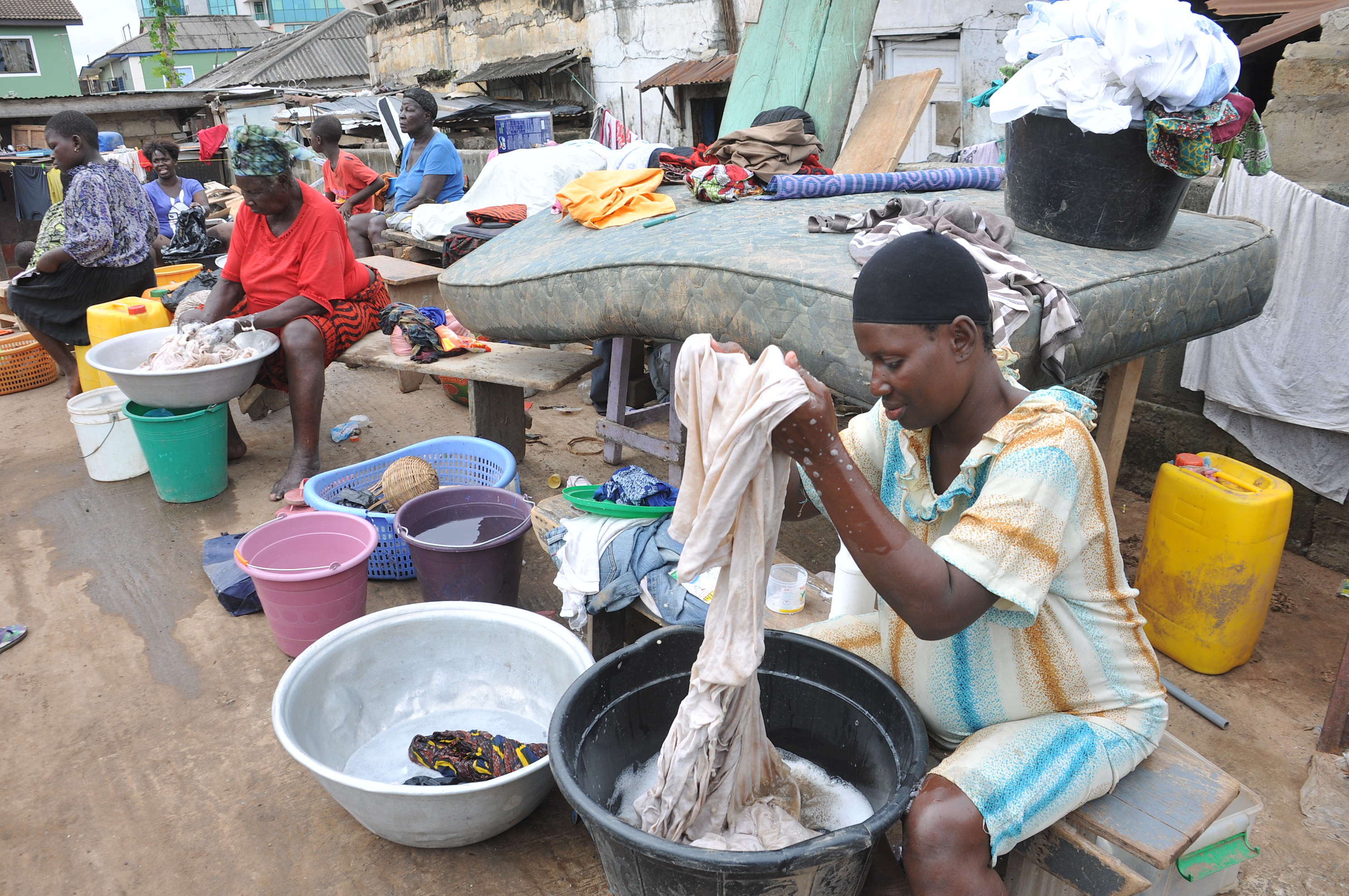 Flood victims of Asylum Down in Accra washing their clothes which were retrieved from the flood