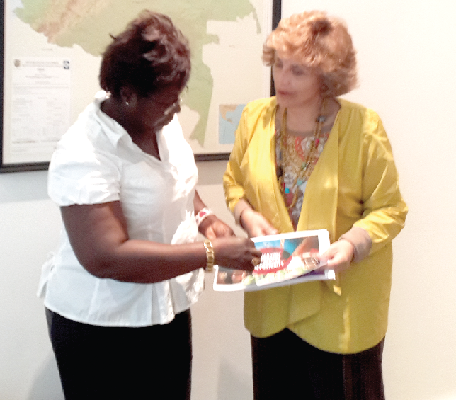 Madam Claudia Turbay Quintero  right   the Colombian Ambassador interacting with Ms Kate Baaba Hudson of the Daily Graphic 