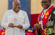 President Akufo-Addo displaying a plaque presented to him by the Most Rev. Dr Paul Kwabena Boafo (right),  Presiding Bishop of the Methodist Church of Ghana