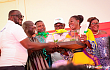 The Vice-President, Dr Mahamudu Bawumia (2nd from left), presenting a miniature house to  Stella Gyimah Larbi, a teacher at the Adenta Community Junior High School  in the Greater Accra Region, who was crowned the 2022 National Best Teacher. Looking on is Dr Yaw  Adutwum, (3rd from left), Minister of Education 