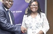 Dr Philip Addison, Governor of the BoG, exchanging documents with COP Maame Tiwaa Addo-Danquah, Director of EOCO