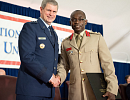 Lt Gen Michael T Plehn, President of NDU in a handshake with Col Amponsah