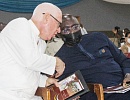 Vice-President Dr Mahamudu Bawumia (right) conferring with Rev. Fr Andrew Campbell during the launch of the SVD Foundation in Accra last Sunday.