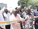  President Akufo-Addo (2nd from left), cutting a tape to commission the buses (right) in Accra. With him are Henry Quartey (left), Greater Accra Regional Minister,; Kwaku Asiamah (2nd from right), Minister of Transport, and Albert Adu Boahen (right), Managing Director, MMT. Pictures: Samuel Tei Adano