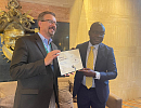 James P. Olshefskyan(left) presenting a certificate to Prof. Alex Dodoo after the meeting 