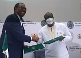 Ken Ofori-Atta (right), Minister of Finance, and Dr Akinwumi Adesina, President of the AfDB Group, exchanging copies of the agreement 