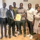 Master Maxwell Borquaye, president of the GJJF, receiving a certificate of recognition from Prof. Peter Twumasi (in suit))
