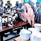 Mohamed Mustapha Yakubu (arrowed), Headmaster of TAMASCO, showing some of the equipment supplied by Geodrill in the Food and Nutrition classroom after the inauguration ceremony