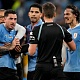 FILE - Uruguay’s Edinson Cavani, right, argues with referee Daniel Siebert of Germany, at the end of a World Cup group H soccer match against Ghana at the Al Janoub Stadium in Al Wakrah, Qatar, on Dec. 2, 2022. 