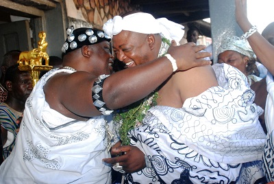  Nii Ayi Bonte II (left), Gbese Mantse  embraces Nii Aklerkwei III, the newly enstooled chief of Adjen Kotoku Kwarteman,  after administering the oath of allegiance to him at Gbese Blohum, at James Town in Accra.