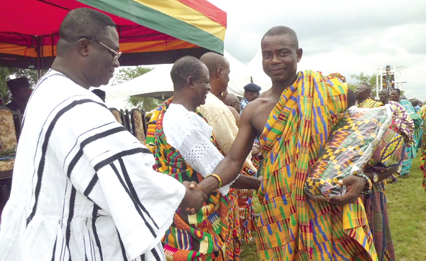 The Volta Regional Minister, Mr Afotey Agbo, with other dignitaries exchanging pleasantries at the durbar ground.