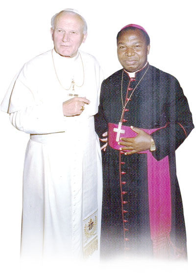 Bishop Lodonu in a pose with Pope John Paul II