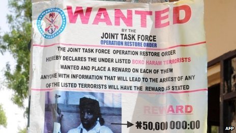 Posters listing wanted militants, including Boko Haram's leader, are on display