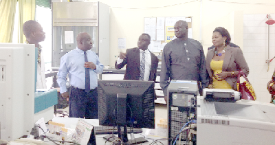Mr Sarpong and his deputy, Mrs Pokua Sawyerr, in one of the laboratories of the hospital with Dr Asare.